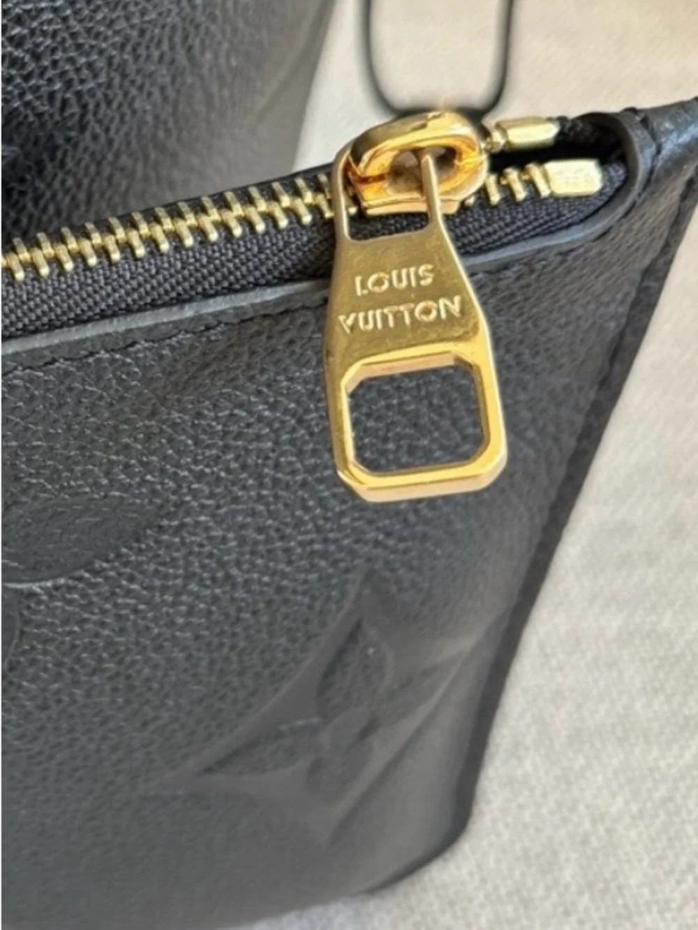 Louis Vuitton Black Embossed Monogram never fall MM with Pouch